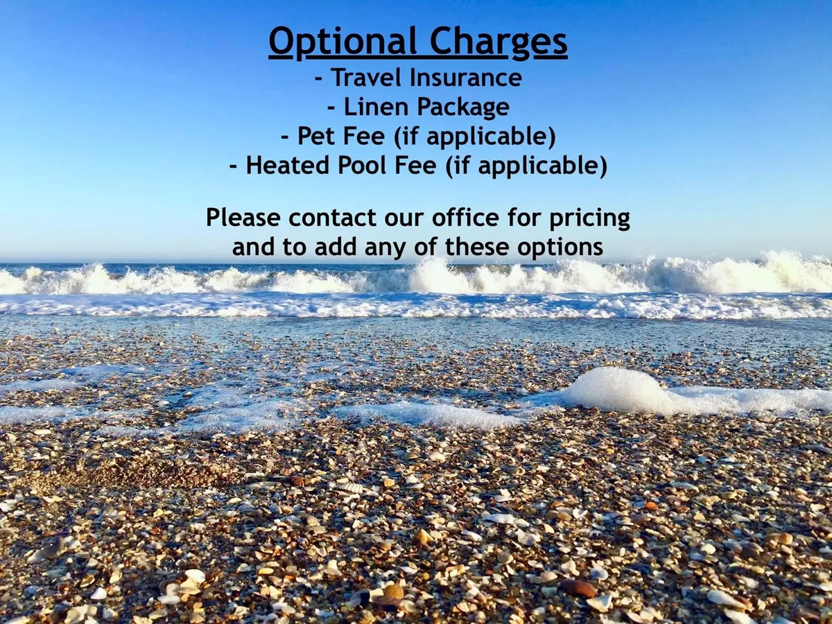 A sweep of pristine beach with gentle waves rolling ashore, scattered shells dotting the sand, and a soft blue sky overhead. The scene is tranquil, inviting families to walk, swim, sunbathe, and build sandcastles along the shoreline.
